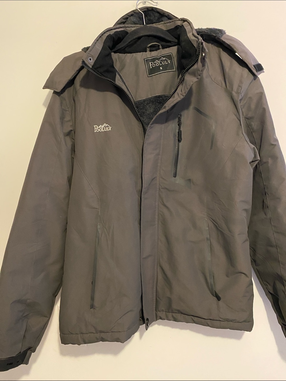 Men's Gray Insulated Ski Jacket with Detachable Hood. Has thickness.